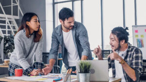 creative designer team argument at casual meeting table and walk out from meeting in modern office