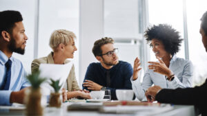 Shot of a group of businesspeople sitting together in a meeting